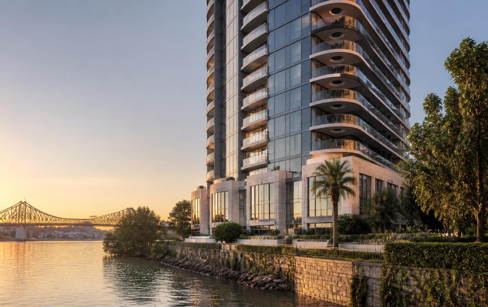 Luxury riverfront residential tower on the Brisbane River at golden hour